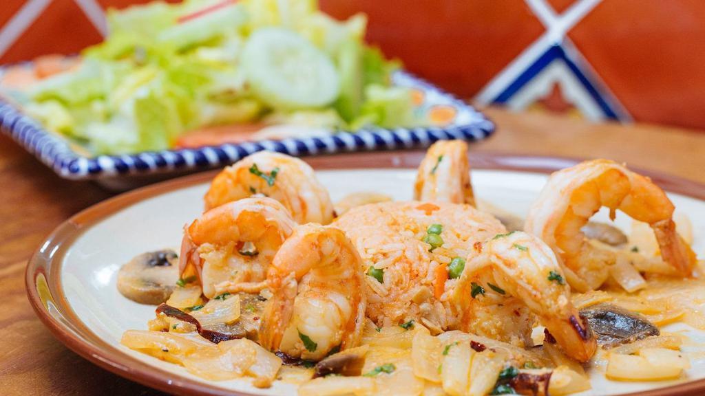 Camarones Al Ajillo · Shrimp with garlic, guajillo peppers, mushrooms, onions, rice, and salad.