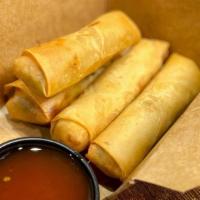 Vegetable Spring Rolls · Crisp rolls filled with cabbage, carrots, onions, celery, and glass noodles served with a ho...