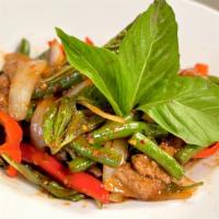 Pad Kaprow · Choice of meat sautéed with thai basil, bell peppers, onions, and green beans with our house...