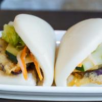 Eggplant Buns · Tempura eggplant. Warm pillowy steamed buns with cucumber, lettuce, spicy mayo and special s...
