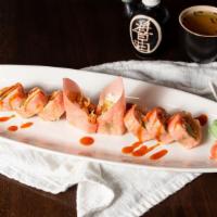 Samurai Roll (8Pc) · Salmon avocado topped with snow crab wrapped in pink pepper thin soybean wrap and drizzled w...