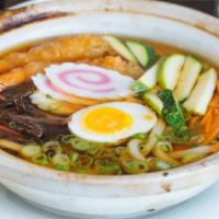 Nabeyaki Udon Noodle · Udon noodle soup with tempura shrimp and vegetables.