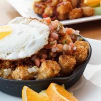 Tater Tot Skillet · 2 eggs, Tater tots mixed with peppers & onions, cheese & choice of meat. pro tip: try the ho...