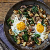 Veggie Skillet · 2 eggs, Mushrooms, peppers, onions, spinach & tomatoes over potatoes.