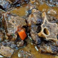 Oxtail · Stewed oxtail with your choice of rice and plantains