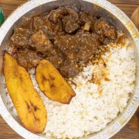 Stewed Goat · Stewed goat with your choice of rice and plantain