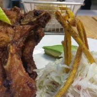 Chuleta Frita.  Fried Pork Chop · 16oz Marinated  Fried Center cut bone in Pork chop