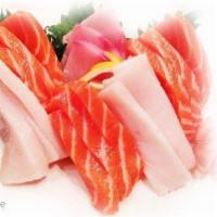 Sashimi Deluxe Dinner · 18 pieces of chef's choice of assorted fillets of raw fish. Consuming raw or undercooked mea...