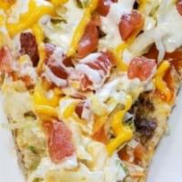 Taco Pizza · Mozzarella, beef or chicken, cheddar, lettuce, tomatoes, and hot sauce.
