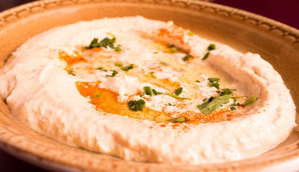 Hummus · A blend of chickpeas, tahini sauce, topped with extra virgin oil.