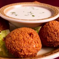 Falafel (6 Pcs) · A blend of chickpeas, parsley, special spices, deep fried served with tahini sauce.