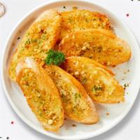 Garlic Bread · (Vegetarian) Housemade bread toasted and garnished with butter, garlic.