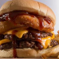 Rodeo Burger · A two-patty Texan delight. Topped with cheddar cheese, our signature crispy onion rings, and...