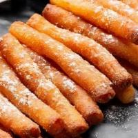 Funnel Cake Fries · 20 crispy & sweet pieces of funnel cake with powdered sugar