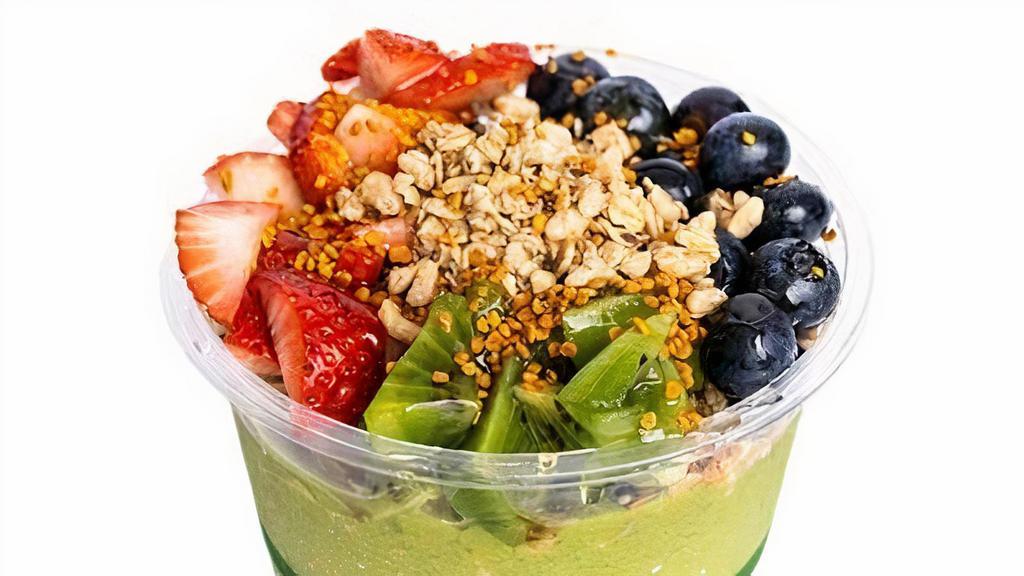Superfood Bowl · Spinach, kale, avocado, banana, and mango blended together and topped with pumpkin seed and flax granola, strawberry, blueberry, kiwi, bee pollen and honey.
