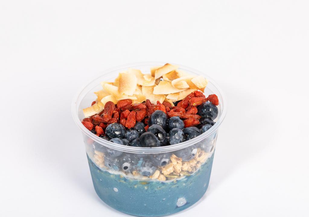 Mermaid Bowl · Banana, mango, pineapple, almond milk and Blue Majik spirulina blended together and topped with pumpkin seed and flax granola, blueberry, goji berry and coconut shreds.