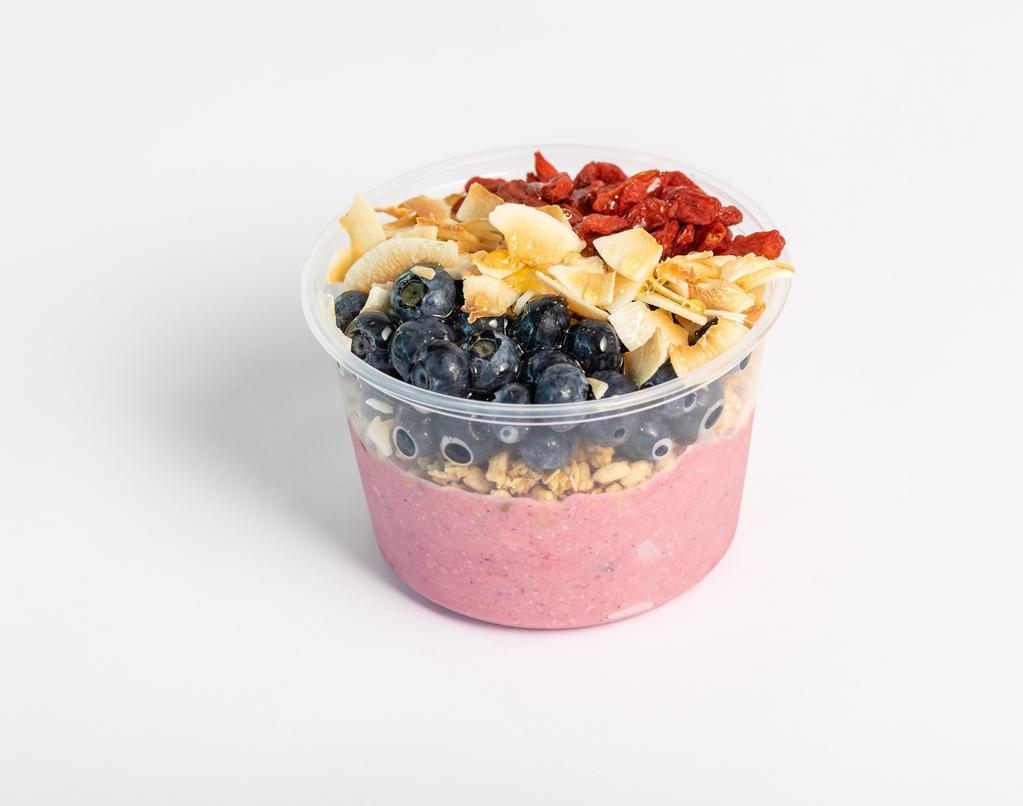 Dragon Fruit Bowl · Banana, pineapple, avocado, oats and pitaya blended together and topped with pumpkin seed and flax granola, blueberry, goji berry and coconut shreds.