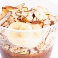 Chocolate Chia Pudding · Cacao chia topped with pumpkin seed and flax granola, banana and sliced almond.