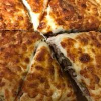 Steak Bomb Calzone · Grilled steak, peppers, mushrooms, onions, mozzarella cheese and salami.
