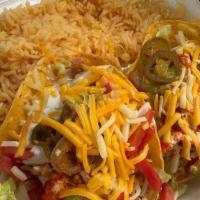 Enchiladas · Choice of chicken, steak, or grilled veggie enchiladas. Cooked in either red or green salad....