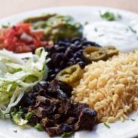 Grilled Steak, Chicken Flautas Combo · Served with rice, beans and salad.