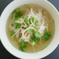 Pho Ga  · Gluten free. Bowls of chicken noodle soup with shredded chicken, sliced onion, scallion, and...
