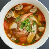Tom Yum Noodle Soup · Spicy. Thai style hot and sour noodle soup combined with shrimp, chicken, mushroom, tomato, ...