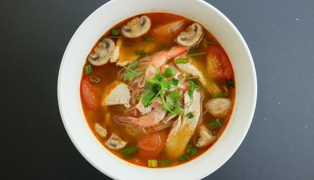 Tom Yum Noodle Soup · Spicy. Thai style hot and sour noodle soup combined with shrimp, chicken, mushroom, tomato, lemongrass, scallion, cilantro, lime juice, and Thai chili paste.