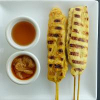 Chicken Satay · Gluten free. Chicken skewers marinated in Thai herb and coconut milk served with sweet and s...