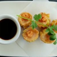 Thai Shumai · Shumai filled with shrimp and mixed Vegetables served with ginger sauce.