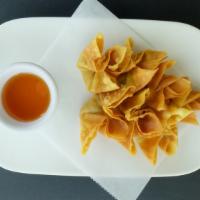 Golden Bag · Crispy wonton skin filled with grounded pork and scallion served with sweet and sour sauce.