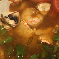 Tom Yum  · Spicy, gluten free. Thai style hot and sour soup with mushroom, lemongrass, lime juice, toma...