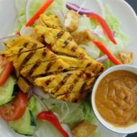 Thai Salad  · Gluten free. House salad with grilled turmeric chicken, lettuce, cucumber, tomato, red onion...