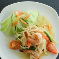 Papaya Salad  · Spicy, gluten free.   Green papaya salad with shrimps, Thai chili, tomato, string bean, and ...