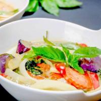 Green Curry  · A thai curry based on coconut milk and fresh green chili paste cooked with bell pepper, carr...