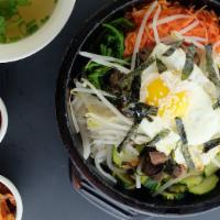 Okdol Bibimbob · Steamed rice topped with assorted Vegetables fried egg, sesame seeds and nori seaweed in siz...