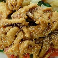 Sesame Chicken · Crispy chicken with sesame sauce and sesame seeds served with stir-fried mixed Vegetables. N...