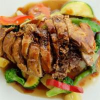 Tamarind Duck · Crispy boneless duck with sautéed assorted Vegetables toppe with thai tamarind sauce. Not se...