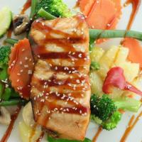 Salmon Teriyaki · Grilled salmon with homemade teriyaki sauce and sesame seeds with sautéed mixed Vegetables. ...
