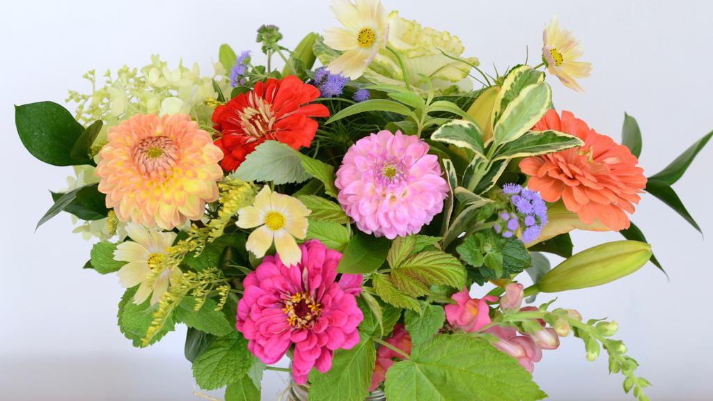 Medium Daily Artisanal Vase Arrangement · Fresh, locally sourced flowers of the day are arranged in a glass vase.
Specific flowers vary every day depending on what our growers offer. The photo is not exactly what will be sent.
Medium arrangements include up to 20 blooms plus greenery arranged in a beautiful, loose garden style.