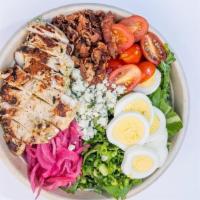Cobb Salad · Sliced chicken breast, avocado, blue cheese, bacon, egg, pickled red onion, scallions, tomat...