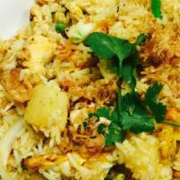 Pineapple Fried Rice · Fried rice made with shrimp, egg, pineapple, cashew, raisin scallions