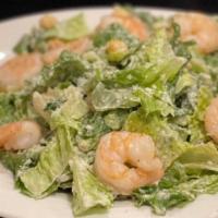 Caesar Salad · Crisp romaine lettuce tossed with Caesar dressing, grated cheese and croutons.