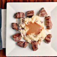 House Steak Tips* · Tenderloin tips served over our homemade mashed potatoes and gravy with vegetable.