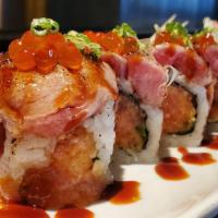 Torched Toro Roll · Salmon, avocado and asparagus topped with torched toro, ikura and fried shallots, scallion w...