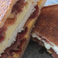 The Grilly Cheese (Combo) · A huge double-decker with three slices of white bread buttered then grilled with white Ameri...