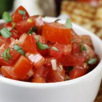 Our Famous Bruschetta · Marinated tomatoes, basil, garlic, onions, and extra virgin olive oil, served with homemade ...