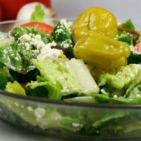 Greek Salad · Fresh romaine lettuce, feta cheese, cucumber, kalamata olives, tomato, and red onions tossed...