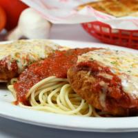 Chicken Parmesan & Pasta · Two breaded chicken breasts topped with our Grotto sauce and a blend of cheese, served with ...