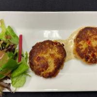 Crab Cake Medallions · Delicious crab meat served with creamy mustard seed sauce and mixed greens.
